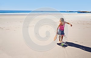 Happy girl, beach and paddle bat with ball for playful summer, holiday weekend or outdoor game in nature. Female person