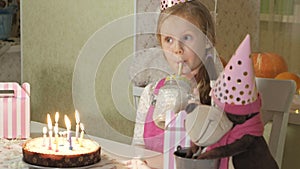 Happy girl with birthday cake with candles