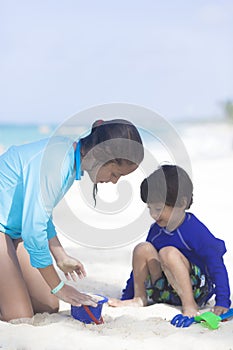 Happy Girl and Boy Playing at the beach