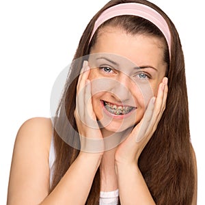Happy girl with braces isolated