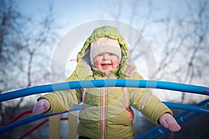 Happy girl on bridge on playground