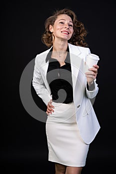 Happy girl in a business suit, she is cheerful and active, open and communicative