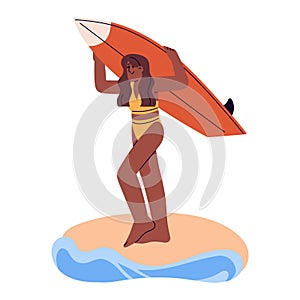 Happy girl carrying surfboard. Active young woman surfer walking with board for surfing on sea beach. Water sport