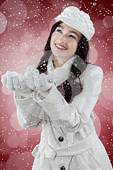 Happy girl catch snowfall