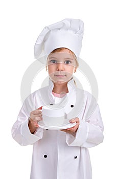 Happy girl chef white uniform isolated on white background. Holding the white cup with a saucer. Portrait image
