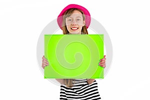 Happy girl child holding empty blank paper isolated on white background. copy space