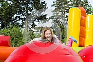 Happy Girl Child on Inflate Castle photo