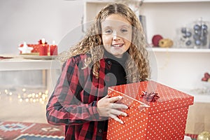 Happy girl with christmas gift box