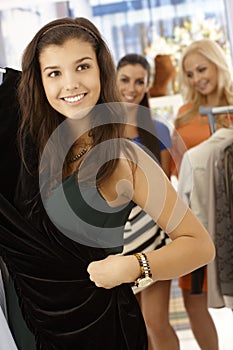 Happy girl at clothes store