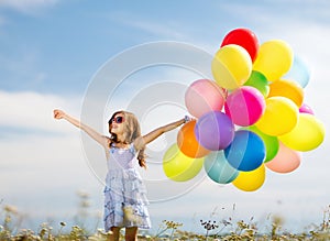 Happy girl with colorful balloons