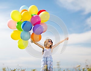 Happy girl with colorful balloons