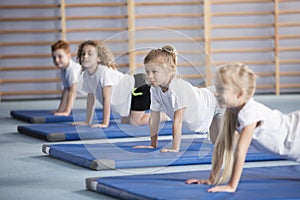 Happy girl during corrective gymnastics