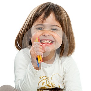 Happy girl with crayons.