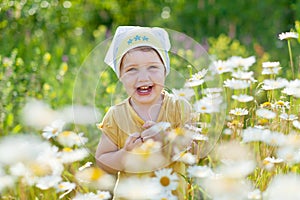 Happy girl in daisy meadow