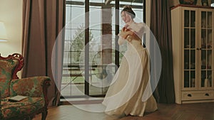 Happy girl dancing spinning in classic room fun joy joyful smiling face. Fairy tale bride adult girl beauty noble woman