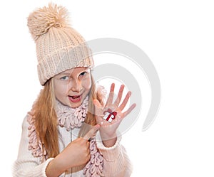 Happy girl demonstrating Christmas symbols painted on hands. Christmas present