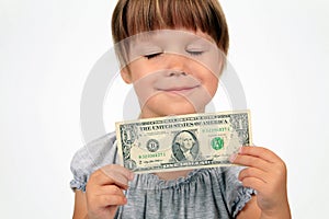 The happy girl with dollar in hands