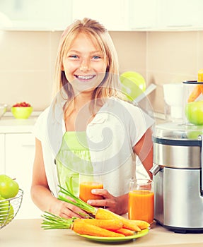 Happy girl drinking fresh juice