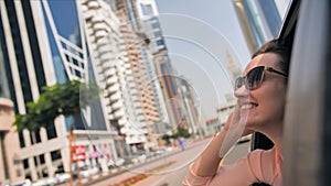 Happy Girl driving a car in Dubai. UAE.