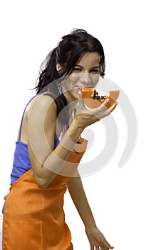 Happy girl eating papaya fruit