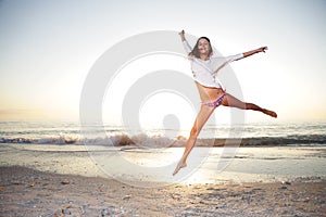 Happy girl enjoy summer day at the beach.