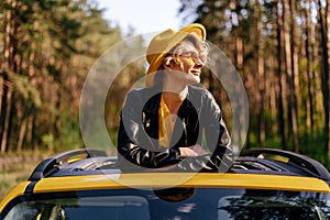 Happy Girl Enjoy Summer Sunlight at Car Sunroof