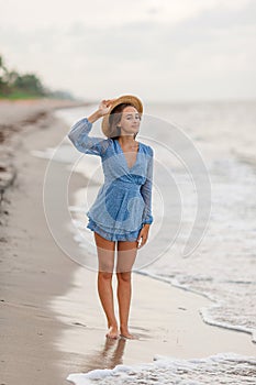 Happy girl enjoy summer vacation on the beach