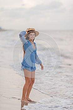 Happy girl enjoy summer vacation on the beach