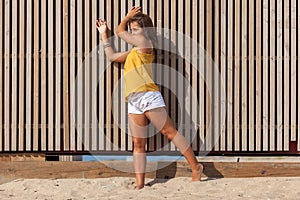 Happy girl enjoying freedom in the sun at the beach