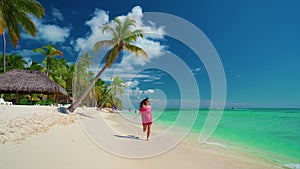 Happy girl enjoying tropical sandy beach, Punta Cana, Dominican Republic