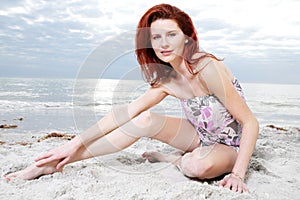 Happy girl enjoys sunny day at the beach.