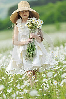 happy girl in the field with flowers