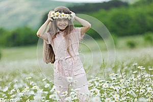 happy girl in the field with flowers