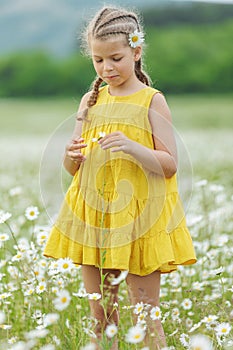 happy girl in the field with flowers