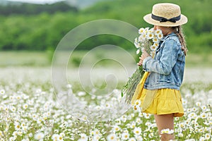 happy girl in the field with flowers