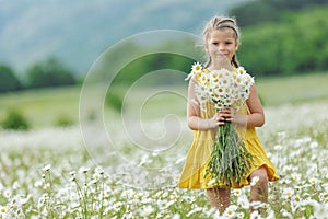 happy girl in the field with flowers