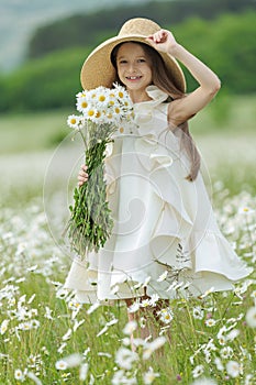 happy girl in the field with flowers