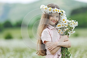 happy girl in the field with flowers