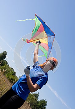 Happy girl flying kite