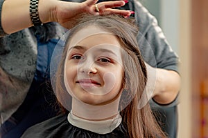 Happy Girl Getting her Hair Cut. A series of photos of a girl getting her hair cut