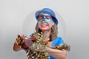 happy girl with a gift in blue