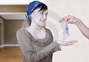 Happy girl given house key - indoor photo