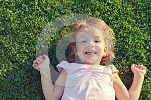 Happy girl on grass