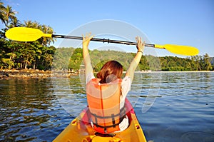 Happy girl having fun on kayak