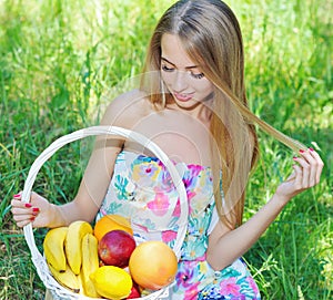 Happy girl and healthy vegetarian food, fruit