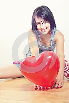 Happy girl with heart balloon