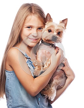 Happy girl holding her lovely yorkshire terrier dog.