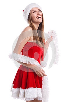 A happy girl im red Christmas costume and white tinsel is laughing happily. Isolated on white background.