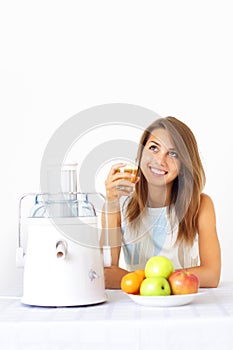 Happy girl about juicer photo