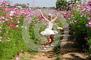 Happy girl jump skirt spread.